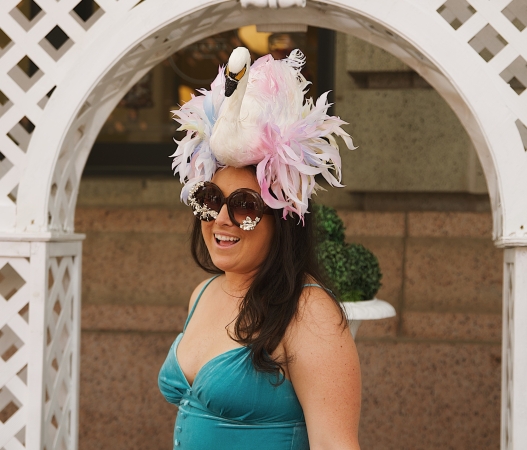 A woman with a swan hat at Derby Day