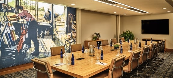 large meeting room with chairs and a long table