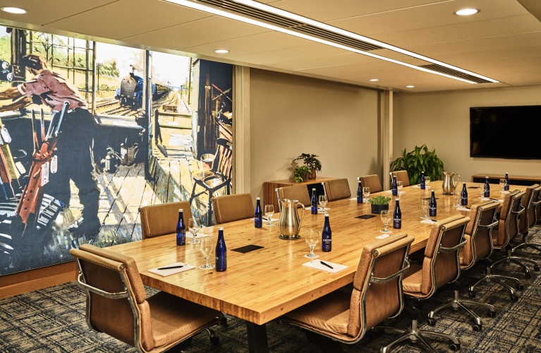 large meeting room with chairs and a long table