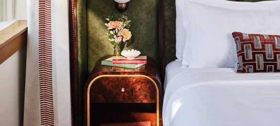 bed side table inside a room at the crawford hotel