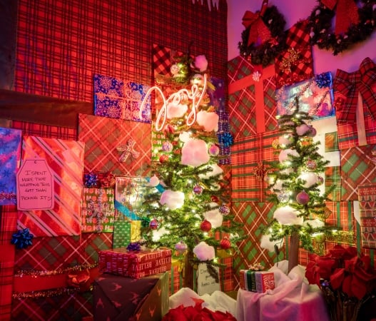 Christmas presents sitting in the corner of a room